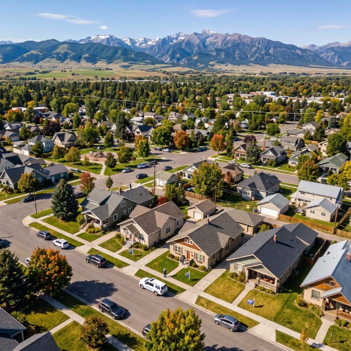 Bozeman Montana residential street with the Bridger Mountains visible in the background illustrating the local housing market a mortgage broker helps buyers navigate